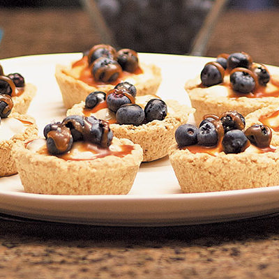 mini blueberry caramel salt tart in a plate